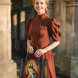 Catholight Ledertasche „Ein Zeugnis der Gnade und des Mitgefühls“